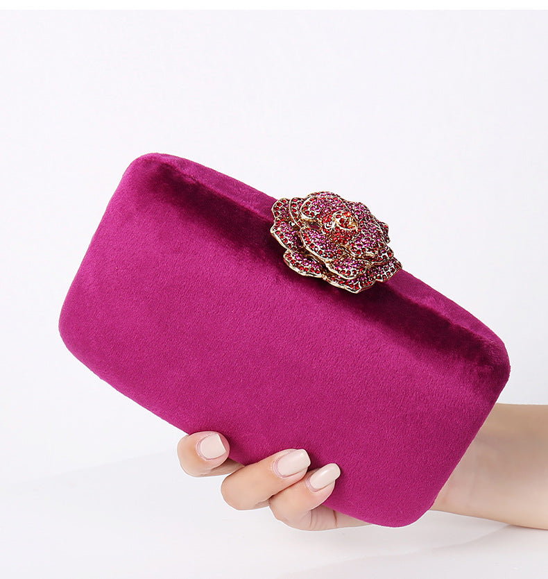 Women's suede rose evening clutch in fuchsia